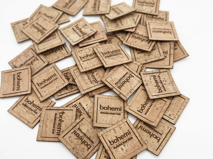 Bohemi signature cork labels. square natural vegan cork leather brand labels. Natural brown colour with bohemi handcrafted burnt into them.